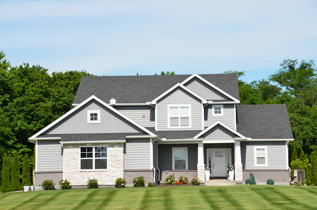 Modern home with a green front lawn