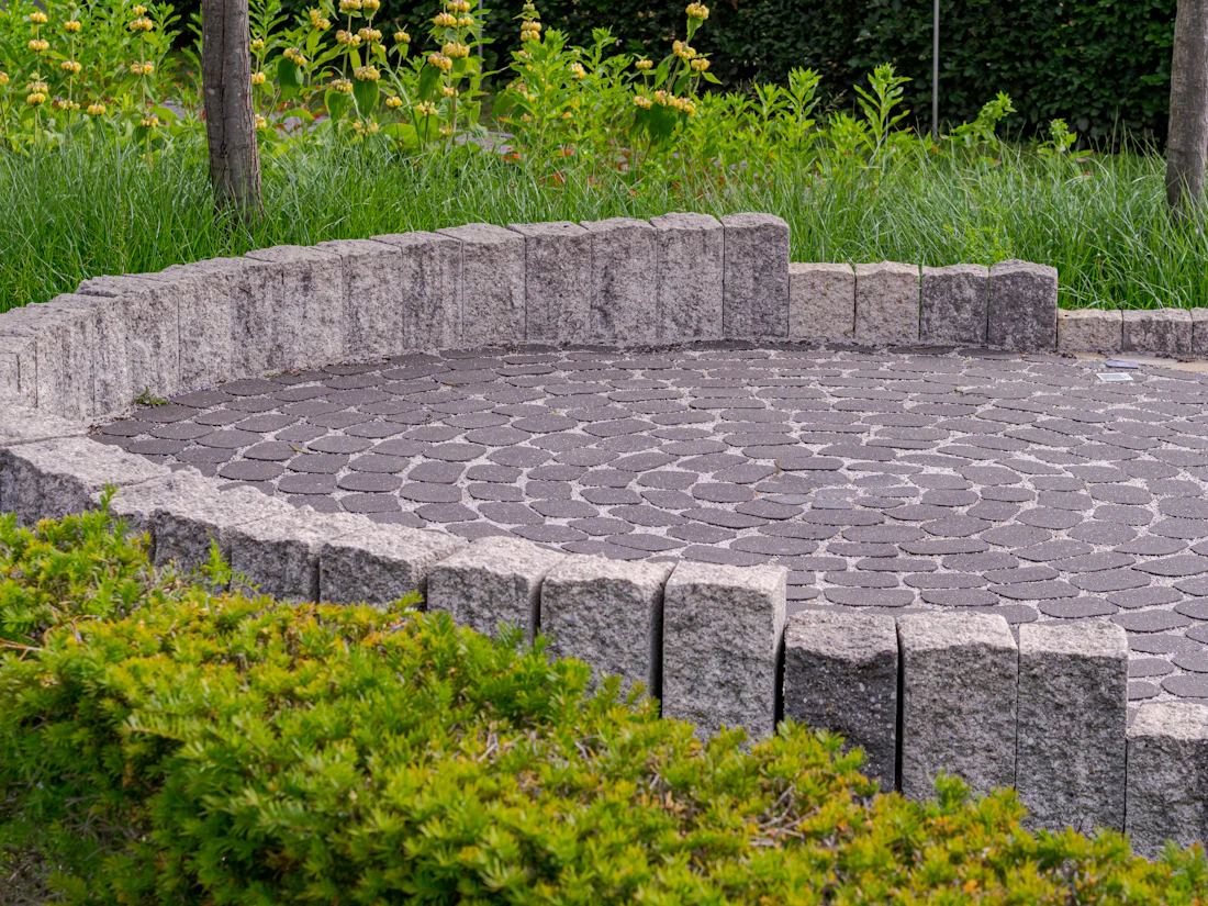 Circular paver patio with seat wall