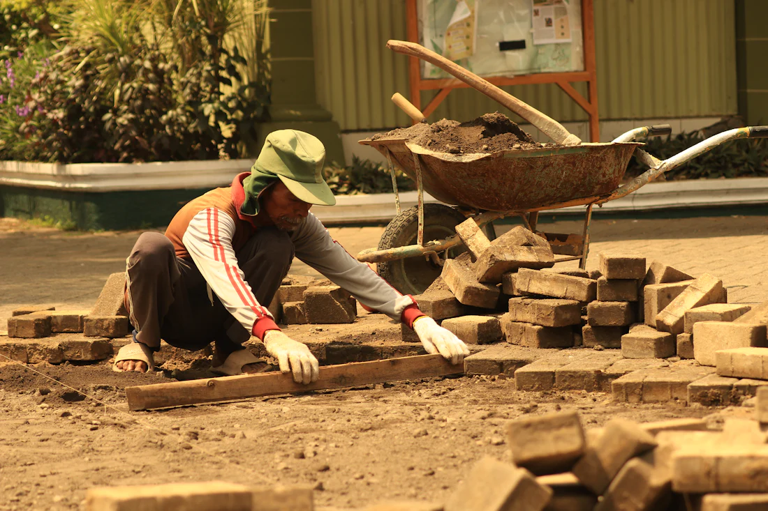 Pavers being laid by hand