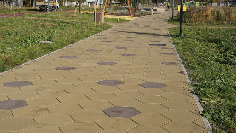 Walkway of hexagonal concrete stones set into a lawn