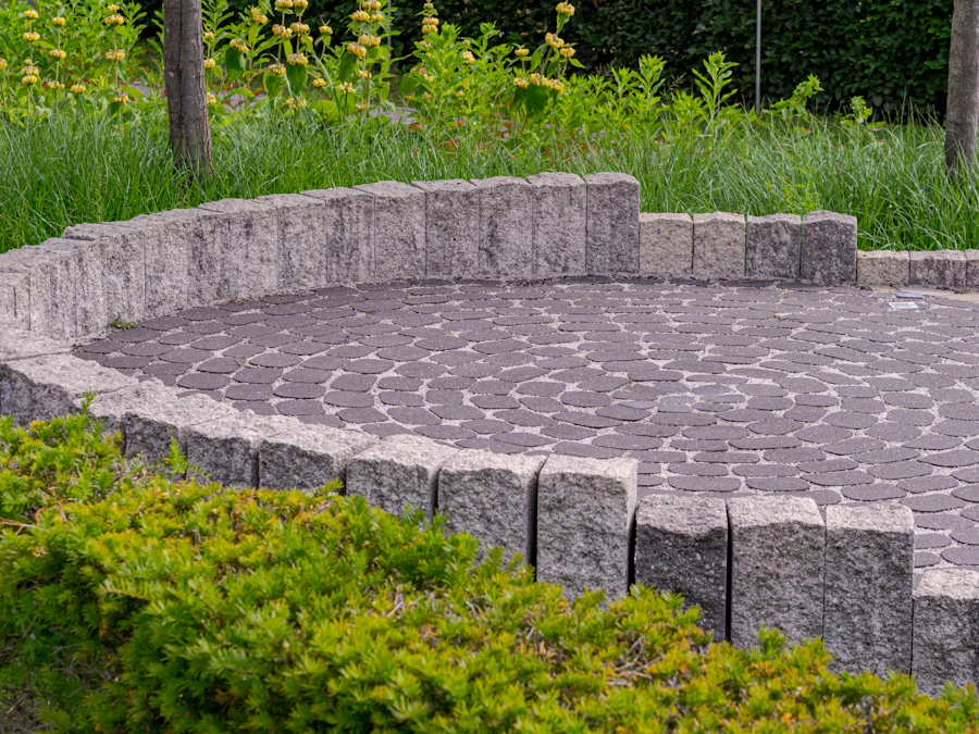 Circular paver patio surrounded by a low stone wall and shrubs